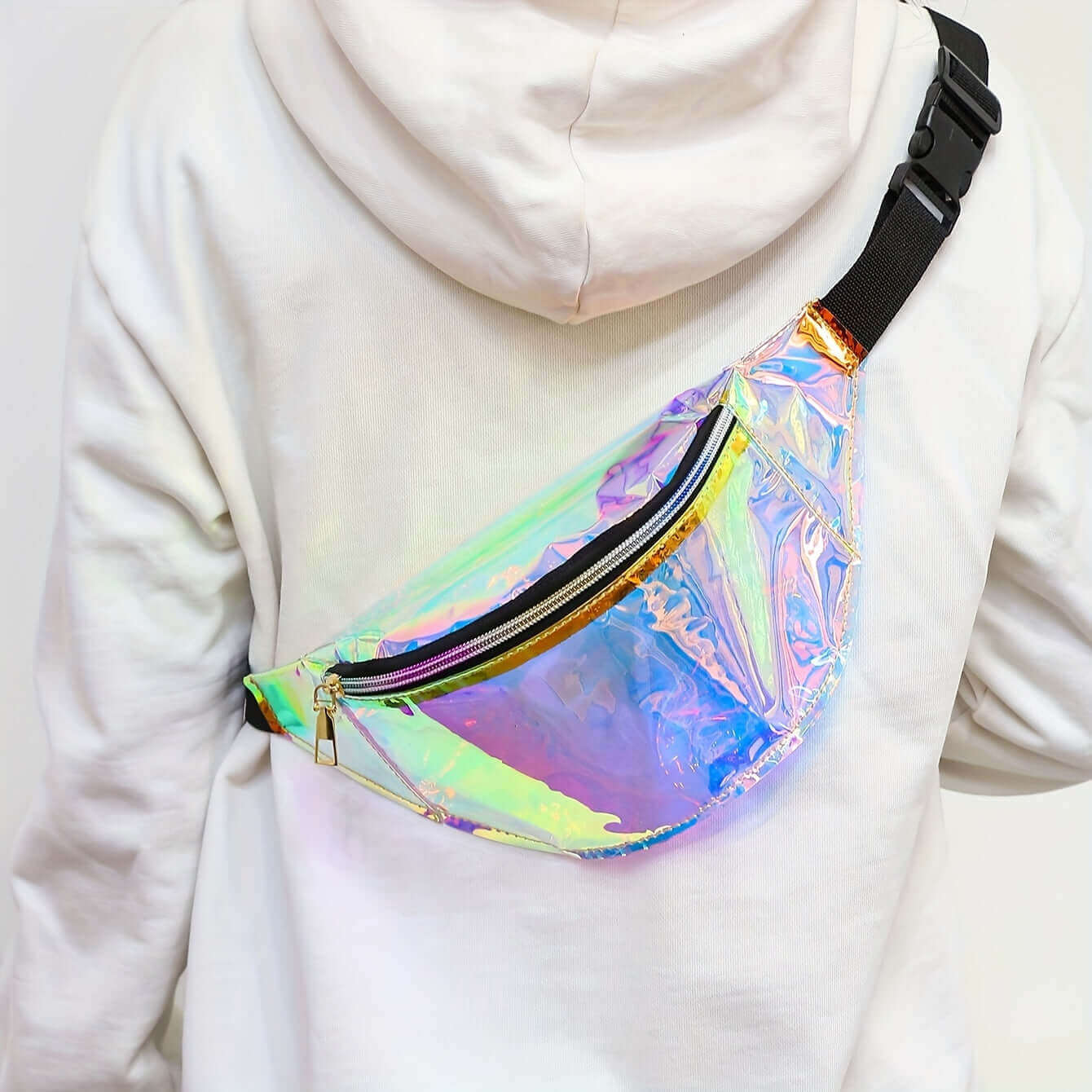 Person wearing RaveFather Holographic Festival Fanny Pack with white hoodie, showcasing its color-changing design