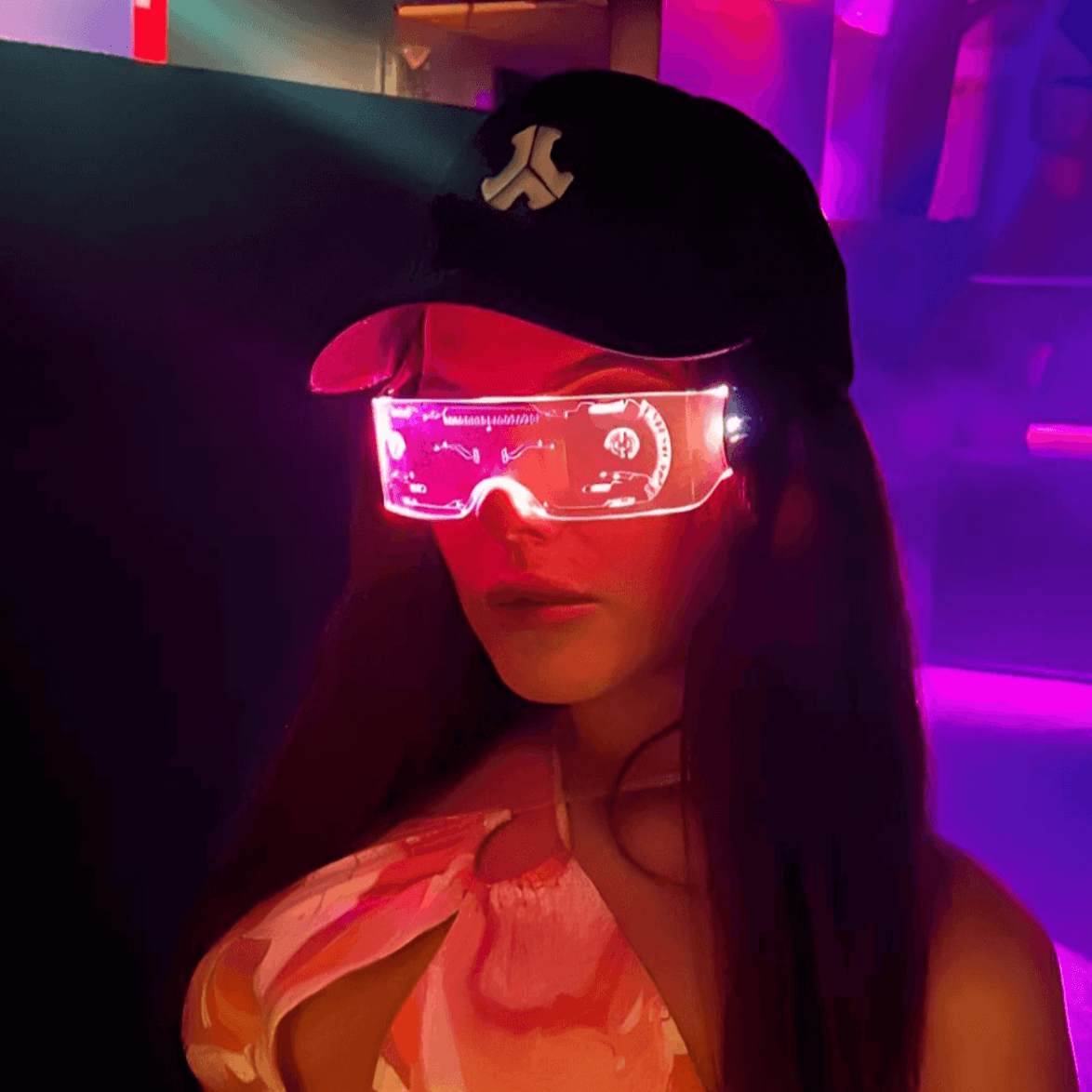 Person wearing RaveFather SpectrumShift LED Rave Vision customizable light show glasses at a party