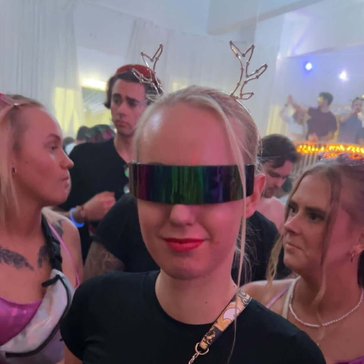 Woman wearing RaveFather's Shade Your Face From Out Of Space sunglasses at a festival